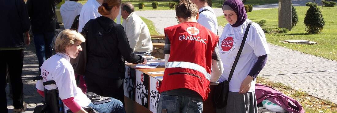 Image of activists share promotional materials related to the elimination of barriers